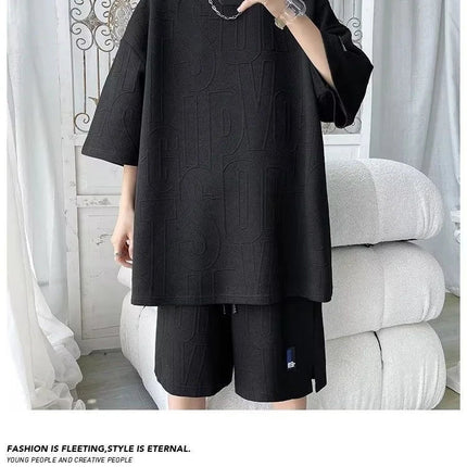 Abito di moda maschile bello set con pantaloncini a maniche corte jacquard sportivi casual larghi Set da due pezzi 2025 Primavera ed estate platinumshop