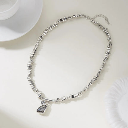 Set di bracciali con collana con pendente in cristallo grigio irregolare semplice barocco Set di gioielli con perline color argento estetico delicato per donna uomo platinumshop