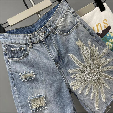 Pantaloncini di jeans con foro sfilacciato floreale con perline alla moda Pantaloncini casual estivi da donna a vita alta in tinta unita stile coreano