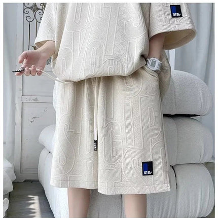 Abito di moda maschile bello set con pantaloncini a maniche corte jacquard sportivi casual larghi Set da due pezzi 2025 Primavera ed estate platinumshop