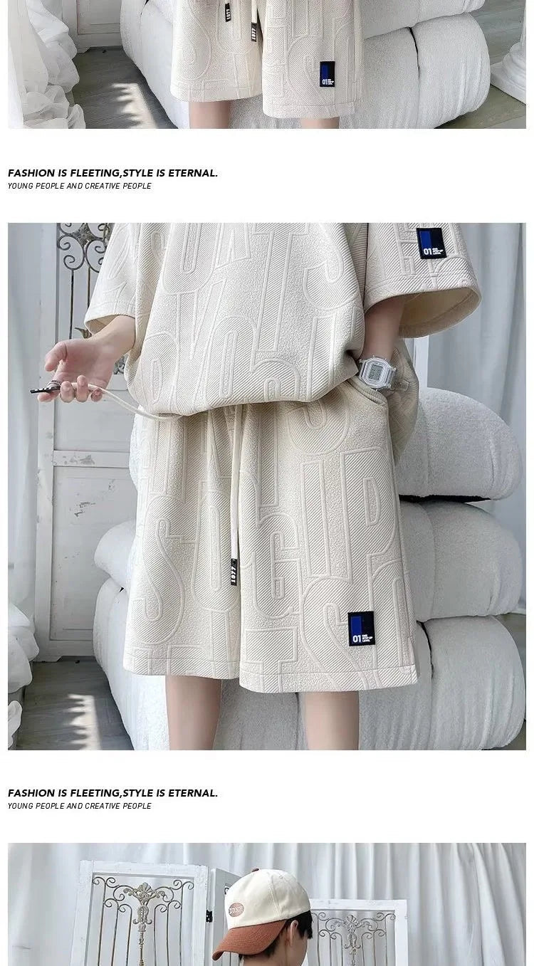 Abito di moda maschile bello set con pantaloncini a maniche corte jacquard sportivi casual larghi Set da due pezzi 2025 Primavera ed estate platinumshop
