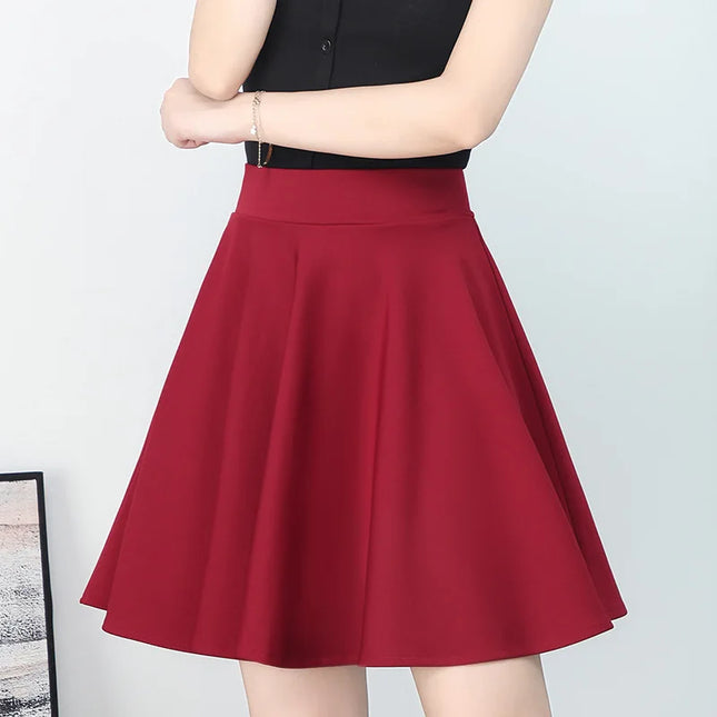 Women's red elasticated skirt for spring and summer, high-waisted design to prevent exposure, with pleated details.